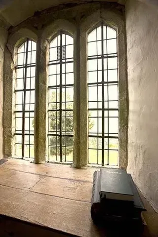 Book on Table by Tinted Window